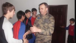 Halil Akar met young players from local volleyball team in Muş province in December 2014 when he was appointed as the airfield commander there.