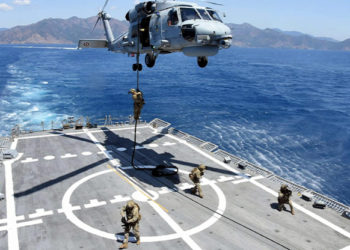 Turkish commandos practiced capturing an island and planted a Turkish flag in a naval exercise targeting Greece