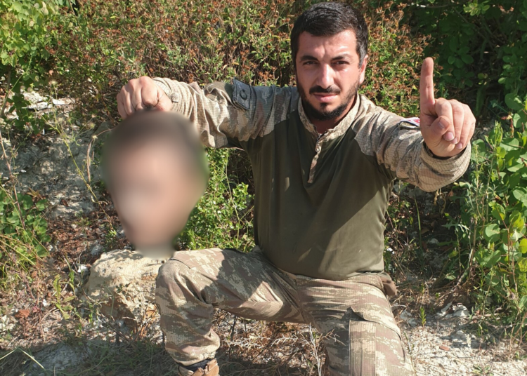 Former Erdogan party official, once pictured holding a severed head, among fighters capturing Syrian city